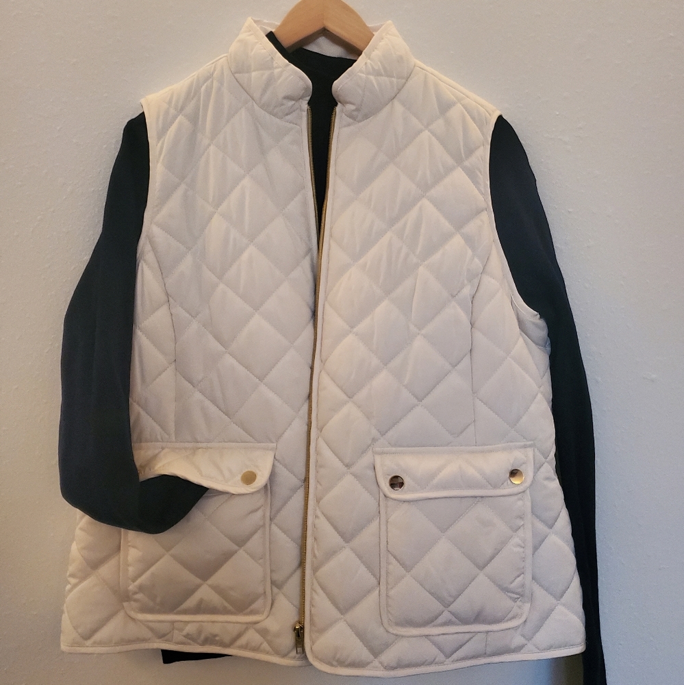 White puffer vest with navy turtle neck